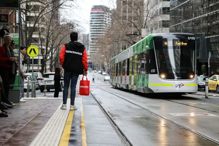students waiting for the tram
